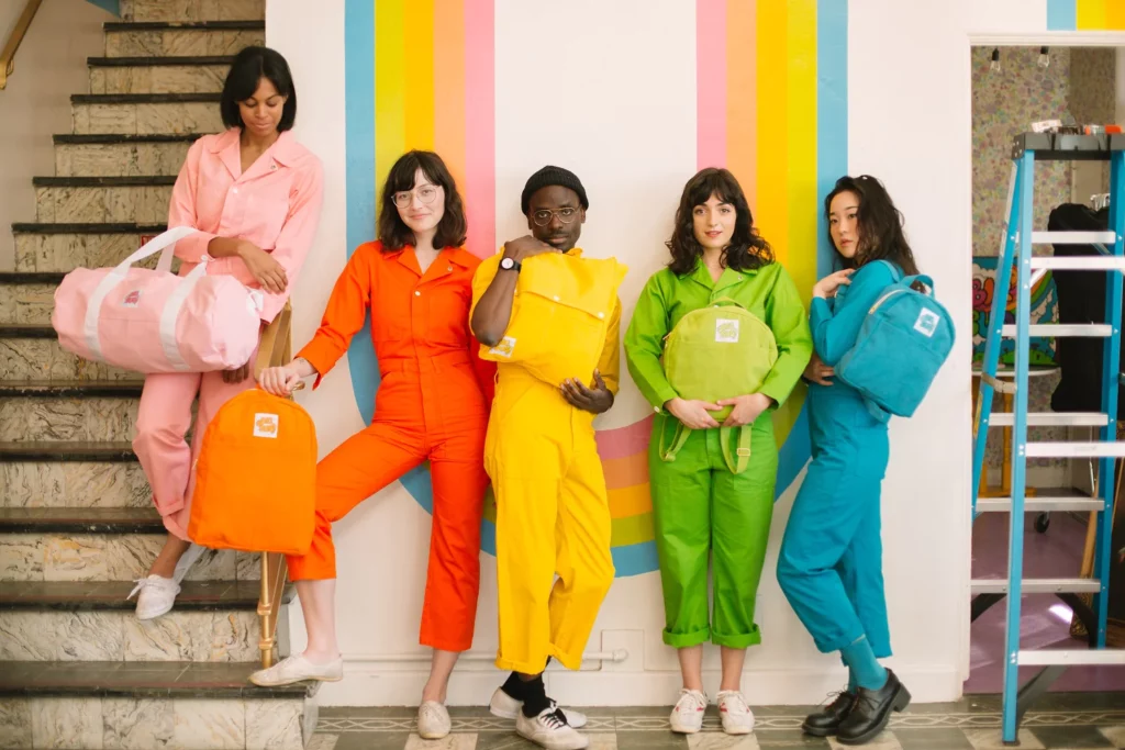 A group of people posing wearing Big Bud Press Gender Neutral clothes