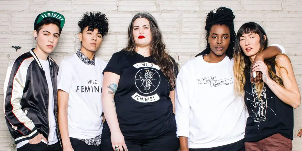 A group of people standing wearing Wildfang, Gender Neutral Clothes