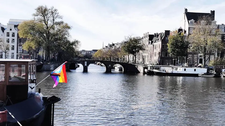 A rainbow flag on the Amstel River in Amsterdam.
